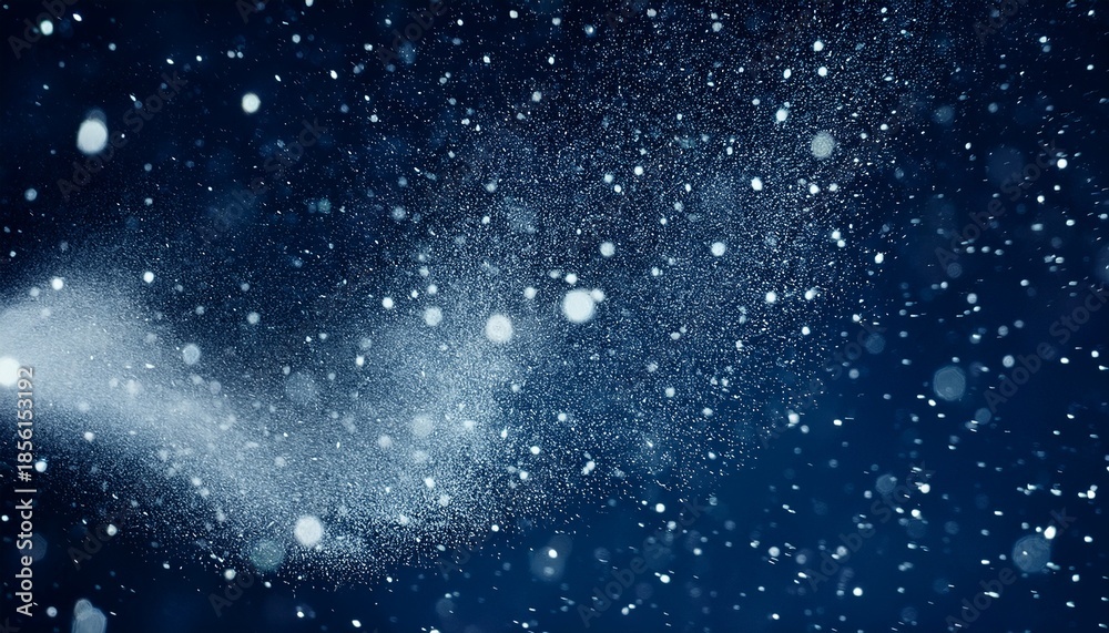 Naklejka premium dust particles flow in air creating a snowstorm effect on a dark blue background ideal for overlay in visual projects