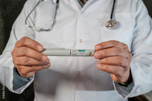 Medical doctor presenting Mounjaro tirzepatide KwikPen medication used for diabetes management and chronic weight loss