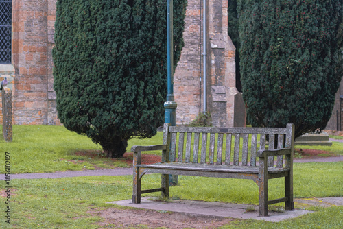 Old beautiful bench on an old heritage park in Stow-on-the-wold town in Cotswolds, England