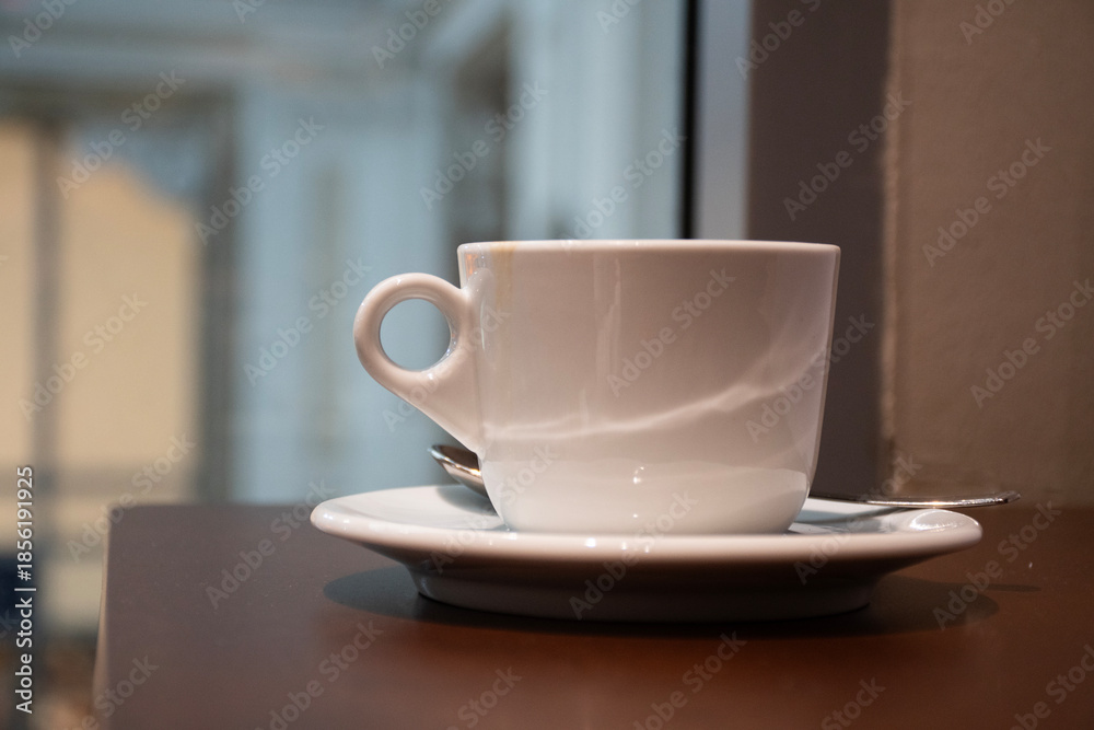 Fototapeta premium Coffee cup mockup to edit your logo on a coffee table