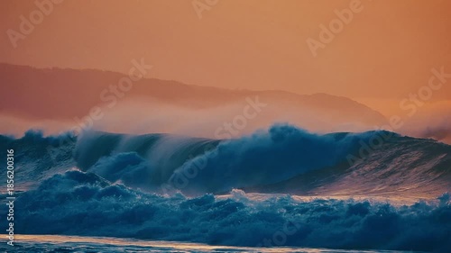 Hawaiian seascape. Ocean wave breaks on the Hawaiian shore of the Oahu island during sunset