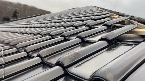 Wallpaper Mural Pitched Roof With Interlocking Ceramic Tiles, Wet Shiny Roof Tiles On Sloped Surface Under Cloudy Sky, Detailed View Of Reflective Ceramic Roof Tiles On Sloped Roof Under Overcast Conditions Torontodigital.ca