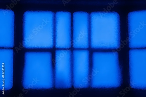 Abstract view of frosted glass with blue light coming through