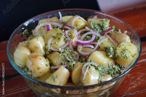 A woman prepares a delicious fresh potato salad