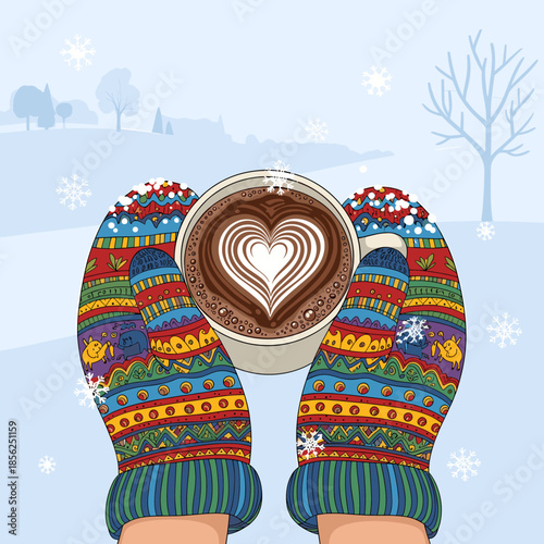 Hands in colorful winter mittens holding a warm cup of coffee with heart latte art in a snowy landscape.