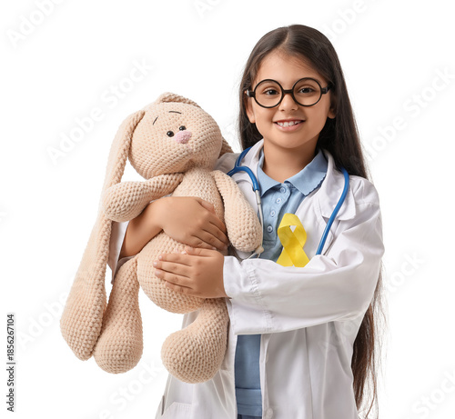 Cute doctor with toy and ye...