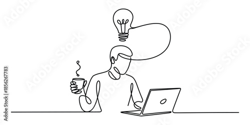 A creative mind at work: person with laptop, coffee, and a bright idea