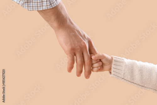 Little girl's hand holding ...