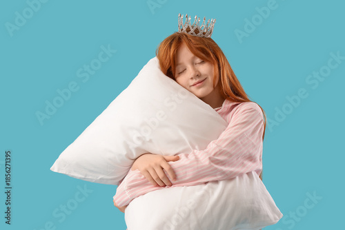 Sleepy girl in pajamas with...
