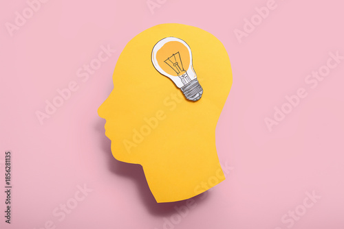 Paper human head with light...