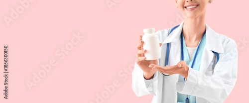 Female doctor holding pills...