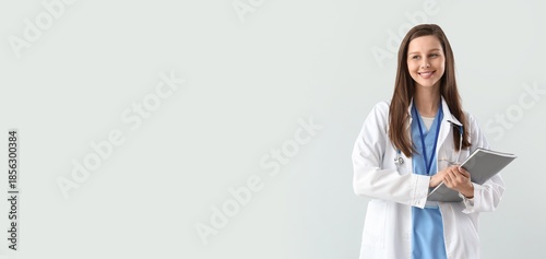 Female doctor holding noteb...