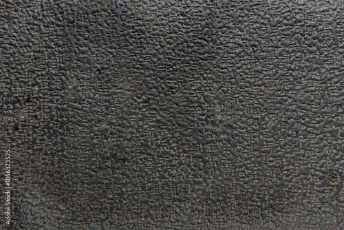 Black industrial rubber texture with pebbled cross-hatch pattern for background, 3D mapping, or overlay design.
