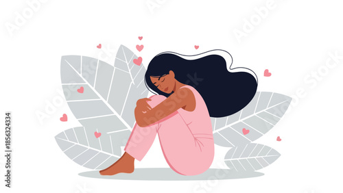 Woman embracing knees with hearts around