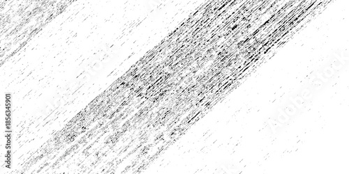 A close up abstract texture of rough dark gray pencil strokes diagonally across a stark white background