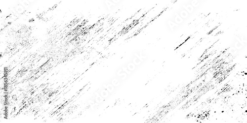 A stark black and white abstract texture featuring diagonal strokes and scattered dark markings across a bright background