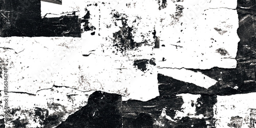 A stark black and white abstract composition featuring fragmented shapes and textures suggesting torn paper or distressed surfaces