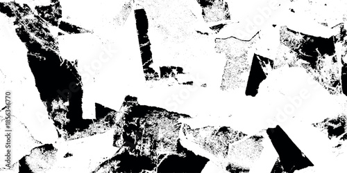 Abstract black and white composition with fragmented shapes and textures evokes a sense of dynamic chaotic energy