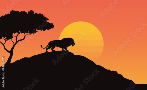 A lion stands on a hill in silhouette against a vibrant orange sunset with a tree to its left