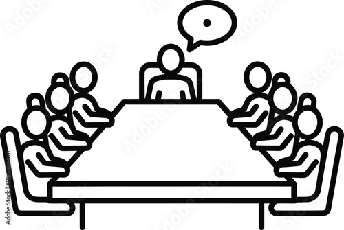 A group of people in a meeting with one person speaking