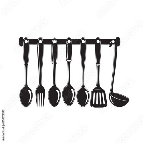 Set of Various Cooking Utensils Hanging on a Rod in a Kitchen