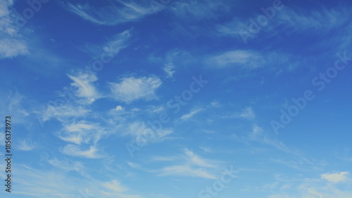 Photography A Beautiful and Serene Blue Sky that is Adorned with Wispy, Fluffy Clouds on a B