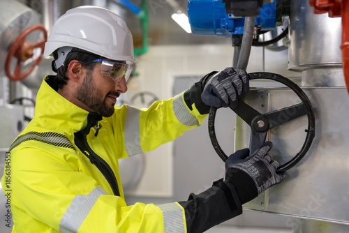 Team of industrial engineers discussing energy-efficient HVAC system implementation.