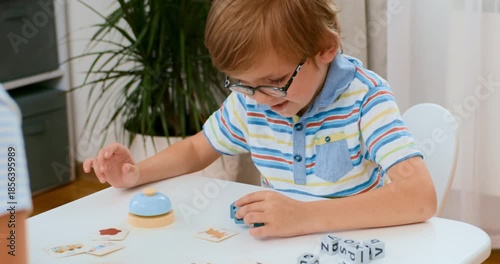 Child Engaged in Educational Board Game at Home
