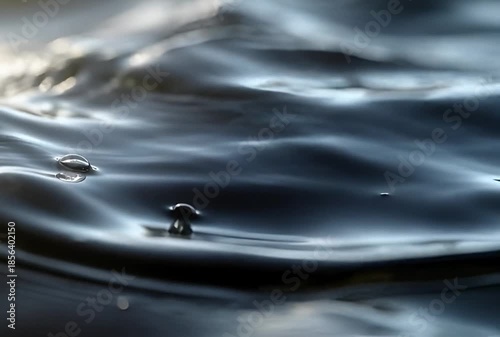 Smooth liquid metal surface flowing slowly, silver chrome texture, soft reflections, abstract cinematic style, seamless loop, 4K