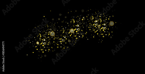 Golden sequins glow with many lights. Glittering dust. Luxurious background of golden particles