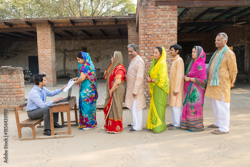 Rural indian people standing in a queue to get their documents verified to get benefits of government scheme.