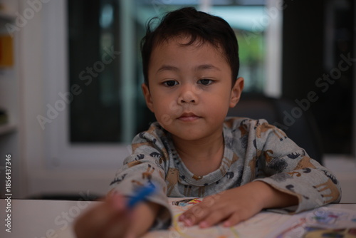 little boy playing with toy