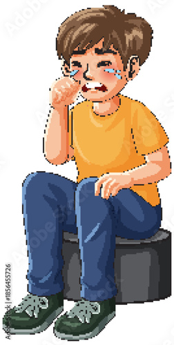 Sad Young Boy Sitting and Crying While Wiping His Tears Away