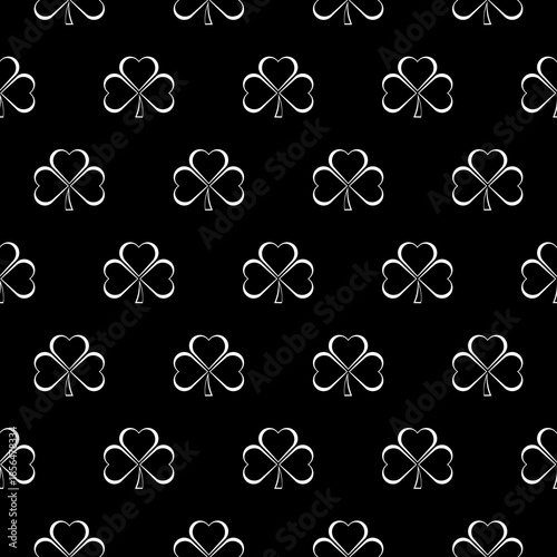 Three leaf clover seamless pattern isolated on black background