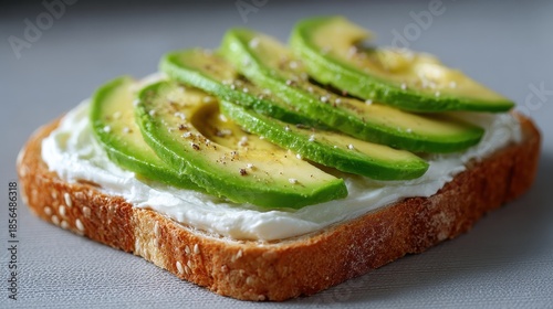 toast topped with cream cheese and avocado emphasizing healthy fats for nutritious snacks