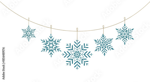 Blue snowflakes hanging from a string on a white background