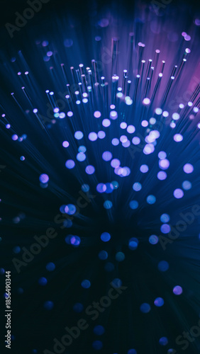 Vertical abstract background featuring deep blue and purple glowing bokeh lights with floating particles in a dark space.