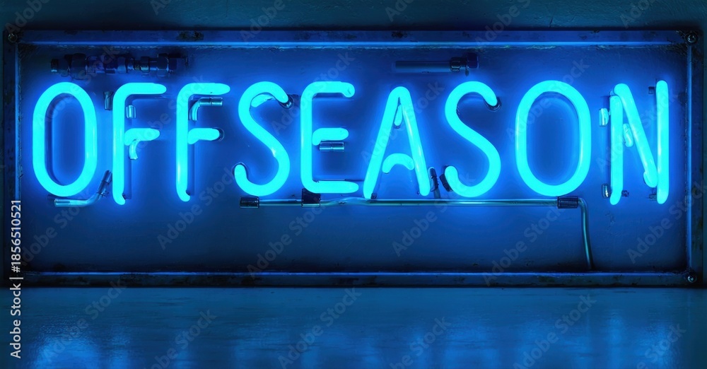 Obraz premium Bright blue neon sign spells OFFSEASON. Dark background creates strong contrast, highlighting glowing letters. Simple, direct message.