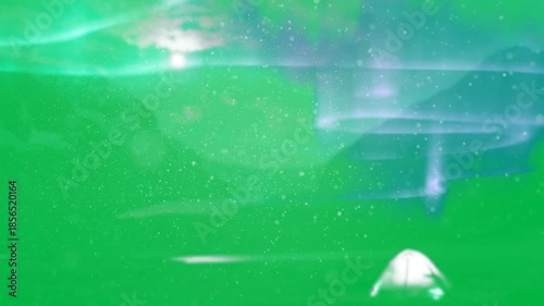 Animation of snow falling with glowing purple blue aurora borealis