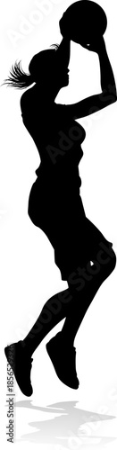 Silhouette of athletic woman female basketball player with basketball ball. Sports concept.