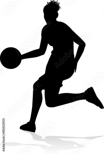Silhouette of athletic woman female basketball player with basketball ball. Sports concept.