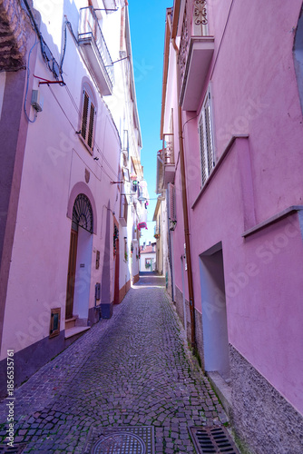A narrow street among the old houses of Capriati a Volturno, a small town in the province of Caserta, Italy.