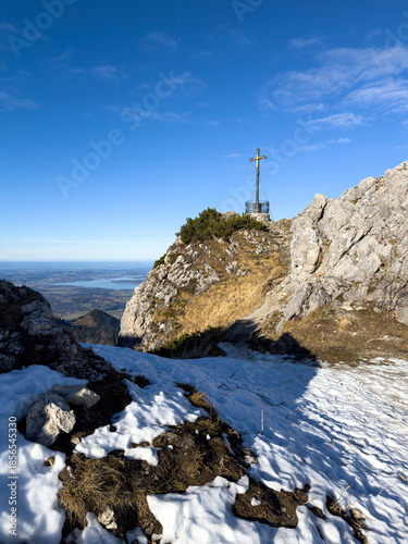 Chiemgau as a Bavarian Region with a beautiful summit cross peak view and a true hike destination 