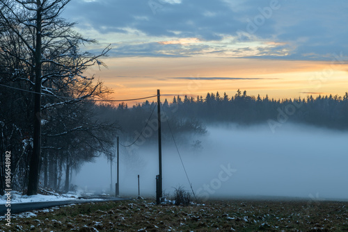 Winter sunset with inversion fog from valleys in Nemci village