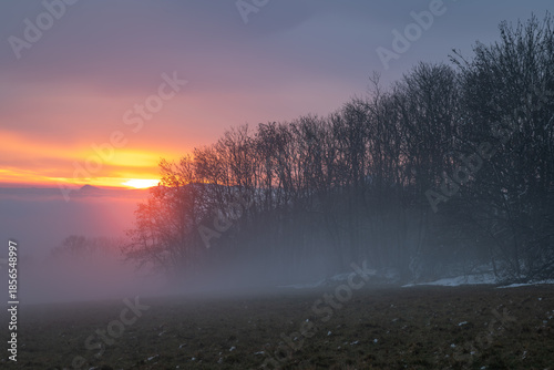 Winter sunset with inversion fog from valleys in Nemci village