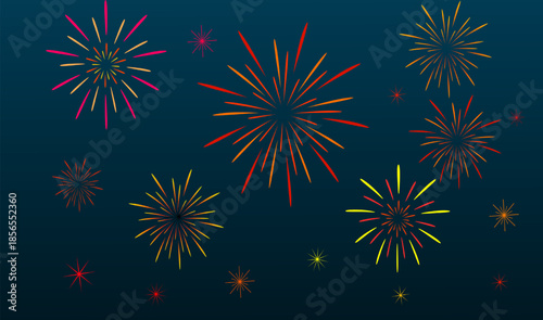 Colourful pyrotechnics display of red and blue fireworks explodes in the night sky during a festive New Year or July Independence Day holiday celebration event