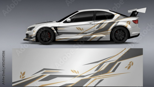 White sports car with custom abstract geometric and leaf-patterned vinyl wrap design.