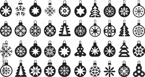 Black and white Christmas ornaments and snowflakes hanging on a white background