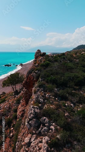 Wallpaper Mural Aerial view of Mavikent Beach, with its long stretches of pebbled shoreline, clear blue water, and surrounding open landscapes in Antalya, Turkey. Torontodigital.ca