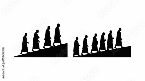 Monks walking up stairs in silhouette.